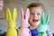 Cute little toddler girl with three colored pastel bunnies Happy baby child having fun with Easter decorations bunny in