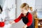 Cute little toddler girl washing hands with soap and water in bathroom. Adorable child learning cleaning body parts