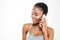 Cute lovely young african american sportswoman talking on mobile phone