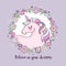 Cute magical unicorn in a flower wreath with inscription `Believe in your dreams`