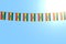 Cute many Ethiopia flags or banners hanging on string on blue sky background - any occasion flag 3d illustration
