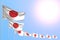 Cute many Japan flags placed diagonal on blue sky with place for your content - any feast flag 3d illustration