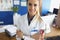 Cute medical worker or head doctor in uniform posing in clinic office