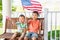 Cute Mixed Race Chinese Caucasian Brothers Play with American Flags