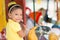 Cute mixed race girl riding a carousel