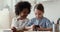 Cute mixed race kids girls playing with smart phone together
