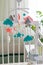 Cute mobile with clouds, stars and moon hanging on a crib in a children's room