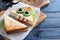 Cute monster sandwich served on wooden table, closeup. Halloween party food