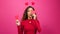 Cute multi-ethnic woman poses with paper hearts, symbol of love studio Valentine