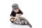 Cute muslim child playing with tabby cat