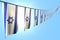 Cute national holiday flag 3d illustration - many Israel flags or banners hanging diagonal on rope on blue sky background with