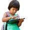 Cute native american girl typing on tablet.