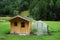 Cute new wooden chalet, next a mini green house. Summer landscape near Heiligenblut am Grossglockner.