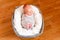 Cute newborn baby boy in a basket. Small hands and feet of the child. Baby wrap