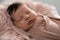 Cute newborn baby sleeping on fuzzy blanket, closeup