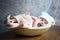 Cute newborn sleeping in a beige plate