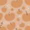 cute orange magic pumpkins fly in the air, on a gentle pastel beige background