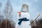 Cute outdoor snowman. Snowy new year`s Christmas fun