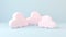 Cute pastel clouds Pink 3d clouds set isolated on a light pastel background. Render magic clouds icon in the blue sky