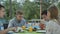 Cute people eat fried chicken near the pool