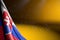 Cute picture of Slovakia flag hanging diagonal on yellow with soft focus and free space for your content - any celebration flag 3d