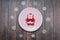 Cute Pig Cookie Gingerbread Symbol of Year on plate and snowflakes on wood background. Christmas