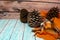 Cute pine cone background. Glittered large Jeffrey pine cones and orange blanket. Cozy concept