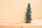 Cute pine tree mock up on wooden table background