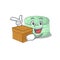 Cute pistachio macaron cartoon character having a box