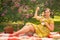 Cute plus size caucasian girl wearing a cute vintage yellow dress and enjoying a vacation in the summer Park on the green grass. c