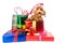 Cute poodle puppy in Santa costume with abundant Christmas gifts