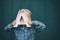 Cute preschool child holding big letter A in front of his face. Back to school, learning alphabet, education concept