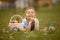 Cute preschool child, whipping his sister on Easter with twig, braided whip made from pussy willow, traditional symbol of Czech