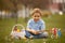 Cute preschool child, whipping his sister on Easter with twig, braided whip made from pussy willow, traditional symbol of Czech