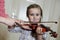 Cute preschool girl learning violin playing