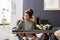 Cute preteen biracial schoolgirl playing piano keyboard