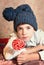 Cute preteen boy in blue knitted hat