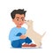 Cute puppy dog licking boy\\\'s face. Happy child hugging and petting a dog. Good frien