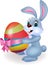 Cute rabbit cartoon holding easter egg