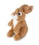 Cute rabbit doll isolated on white background with shadow. Playful brown bunny sitting on white underlay. Plush stuffed toy.