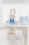 Cute rabbit doll on the shelf in kids room. Easter decoration. shelves with soft toys rabbits in the design of the