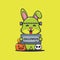 Cute rabbit with frankenstein costume holding halloween greeting stone