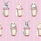 Cute rabbits on a pink background. Easter bunnies. gentle seamless pattern. hare with a cup of coffee