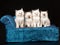 Cute Ragdoll kittens on blue chaise