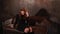 Cute red-haired woman sitting on leather couch and touching hairstyle