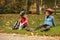 Cute roller skaters sitting on grass