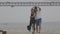 A cute romantic married couple dancing on the pier