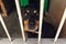 Cute rotweiler dog in shelter cage with crying eyes, sad emotion