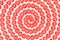 Cute round slices of tomatoes in the form of a spiral or helix isolated on a white background pattern. Top view cut in