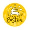 Cute round sticker with the silhouette of the jumping Easter Bunny on a background of yellow field in ears and flowers.